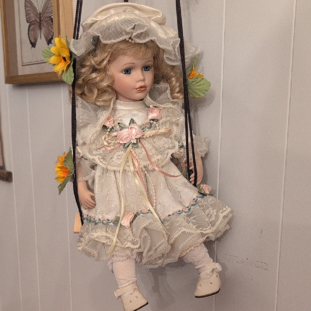 Pink and White Doll with Accessories on Swing